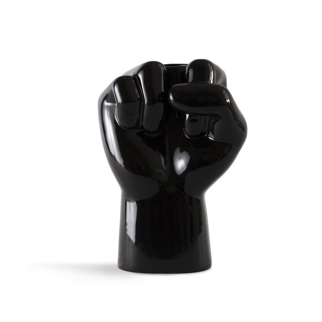 Black ceramic fist-shaped vase on a white background