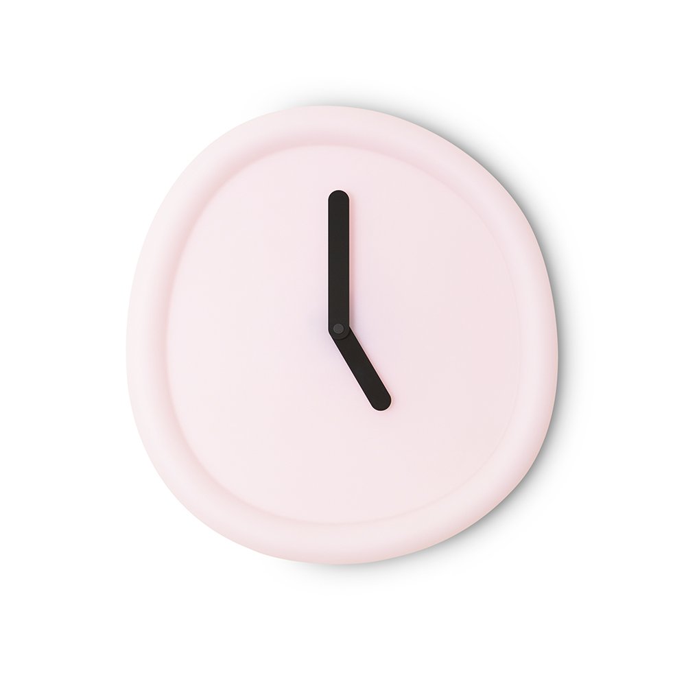Pink wall clock with a black hour hand on a white background