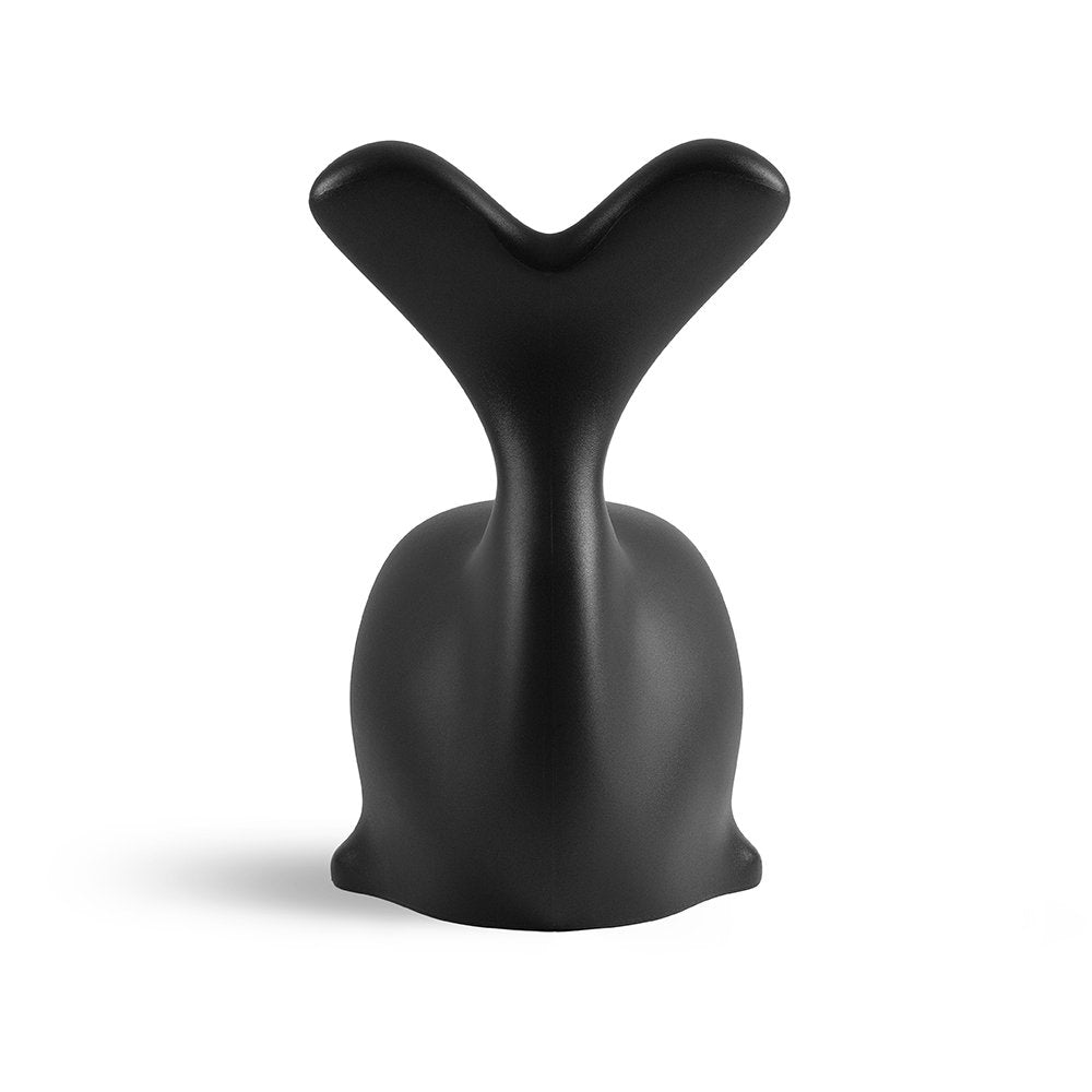 Black decorative object with a unique shape on a white background