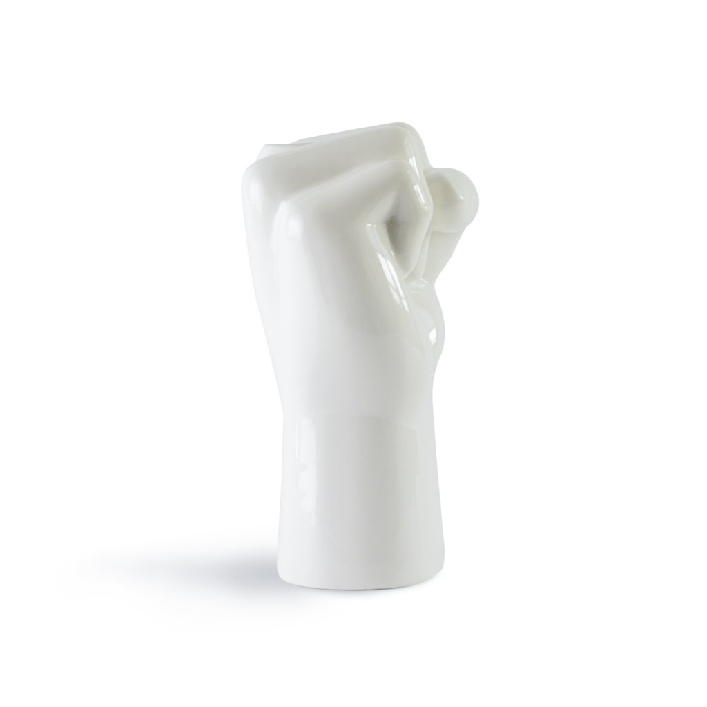 White ceramic vase shaped like a woman with a flowing dress on a white background
