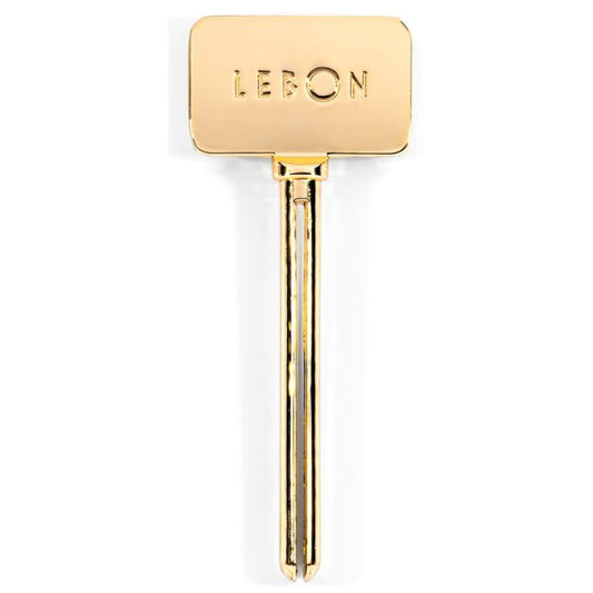 Lebon Gold stainless steel toothpaste squeezer.