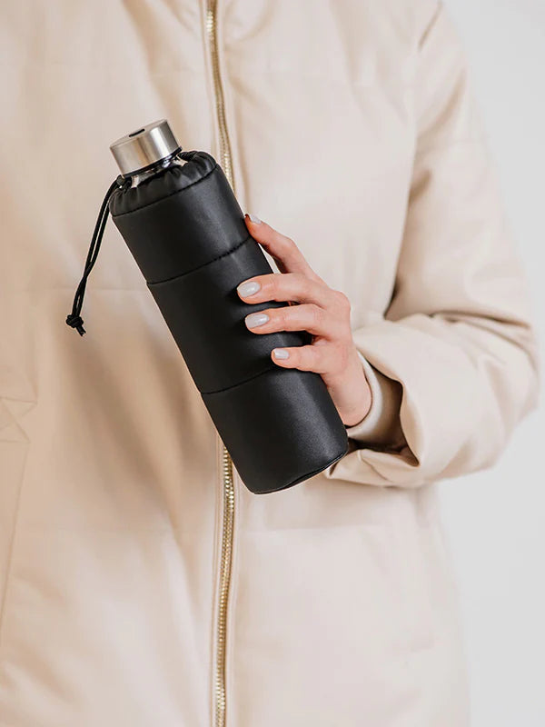 Puffy Black Glass Bottle is made from high-quality borosilicate glass and wrapped in a smooth faux leather cover.
